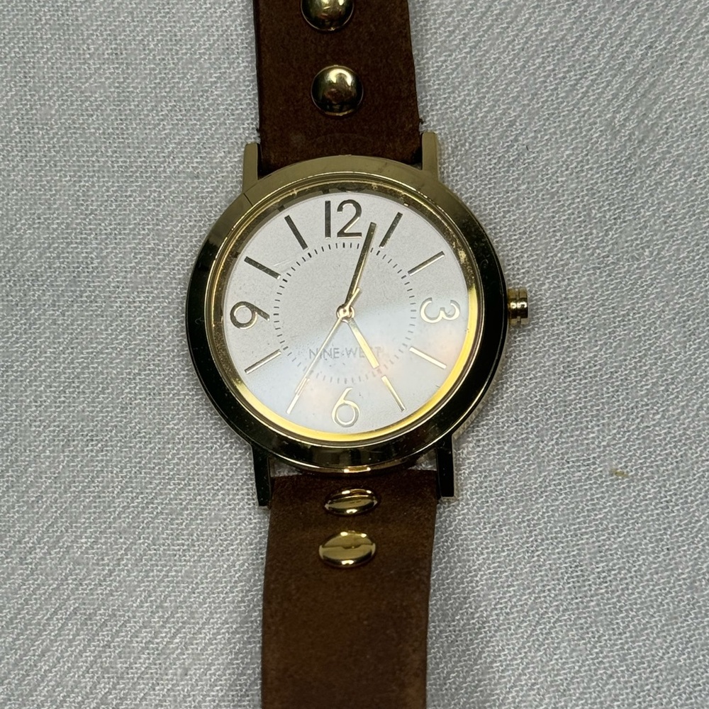 Nine West used women’s watch golden color and brown wristband and golden accents
